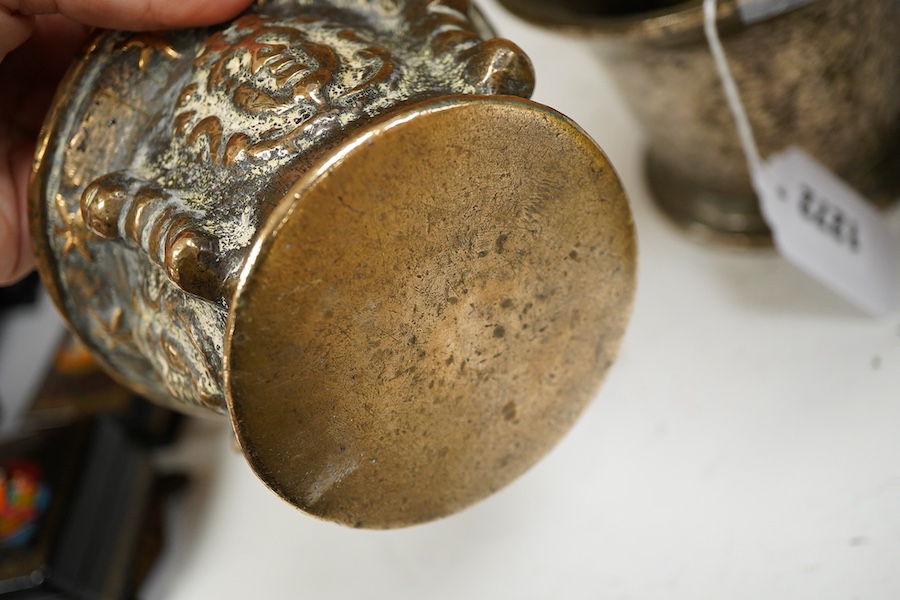 A bronze pestle and mortar, and one other mortar decorated in relief, 18cm in length